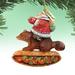 The Holiday Aisle® Fifield Santa on Raccoon Figurine Ornament Derevo Collection Plastic in Brown/Orange/Red | 4 H x 3 W x 2.5 D in | Wayfair