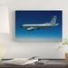 East Urban Home 'An RC-135W Rivet Joint Aircraft Flies over the Midwest' Photographic Print on Canvas in Blue/White | 8 H x 32 W x 1 D in | Wayfair