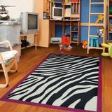 Black/White 79 x 0.32 in Indoor Area Rug - World Menagerie Jurado Anti Skid Bacterial Animal Print Tufted Area Rug Nylon | 79 W x 0.32 D in | Wayfair